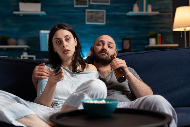 Young couple spending evening together dressed in pajamas enjoying spending time together