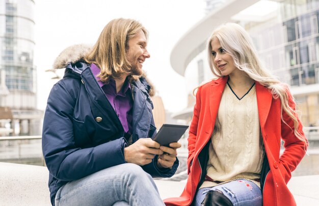 Young couple spending time in the afternoon and watching ebooks on a tablet