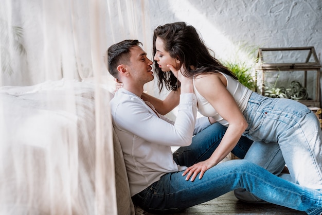 Young couple spending time in their beautiful countryside house. Romantic lifestyle moments