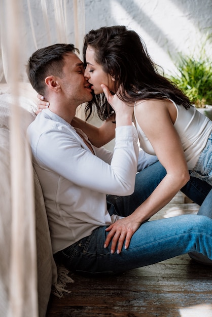 Young couple spending time in their beautiful countryside house. Romantic lifestyle moments