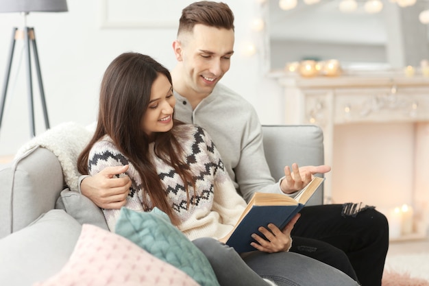 Young couple spending time together on winter vacation at home