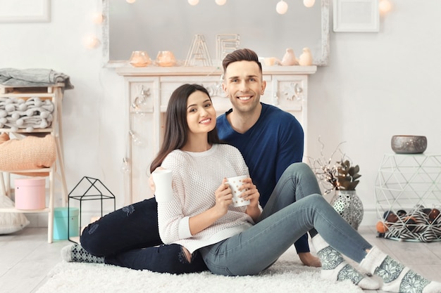 Young couple spending time together on winter vacation at home