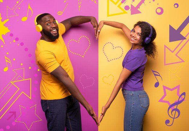 Young couple standing against wall