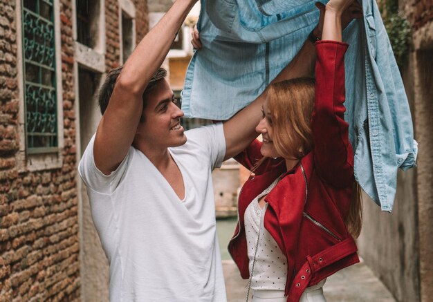 Photo young couple standing in front of a woman