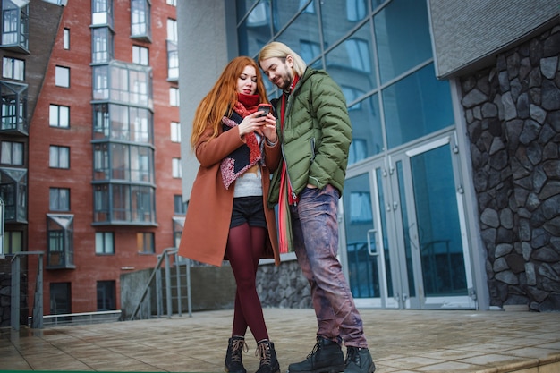 Young couple standing together in the modern city