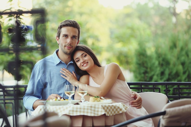 Young couple in street cafe