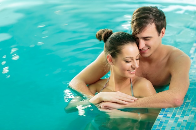 Young couple in the swimming pool