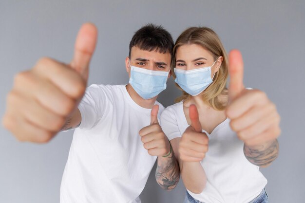 Young couple and taking off their mask