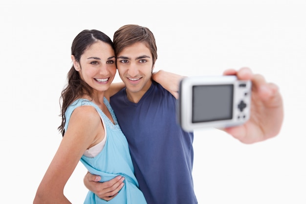 Young couple taking a picture of themselves