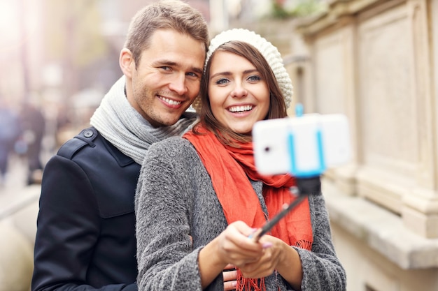 young couple taking selfie in the city