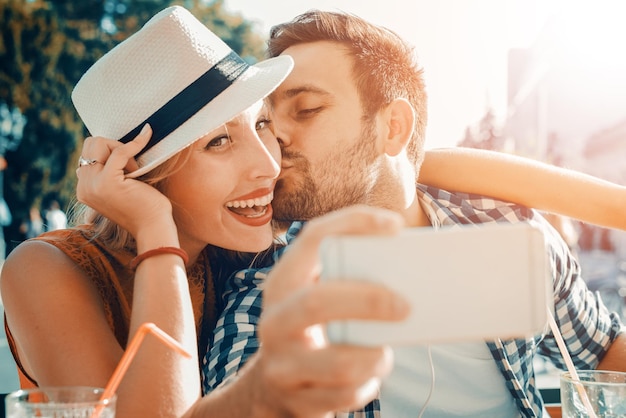 Young couple taking selfie