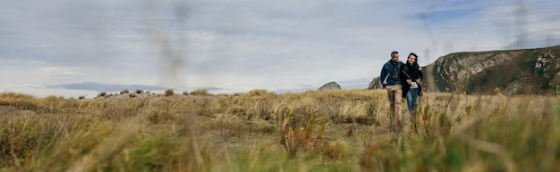 Young couple taking a walk near the coast