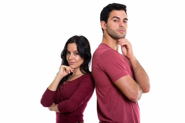 young couple thinking together with back to back