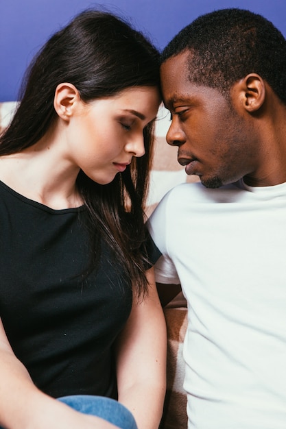 Young couple together, black man and white woman closeup