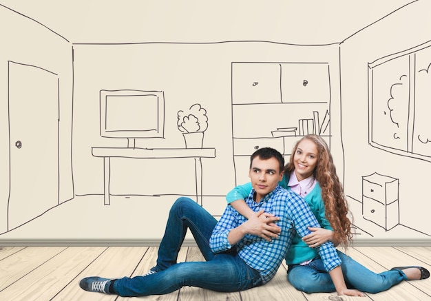 Young couple together on home background