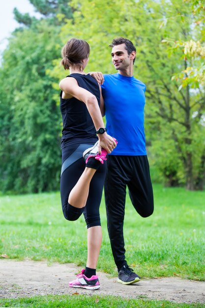 Young couple training in the park