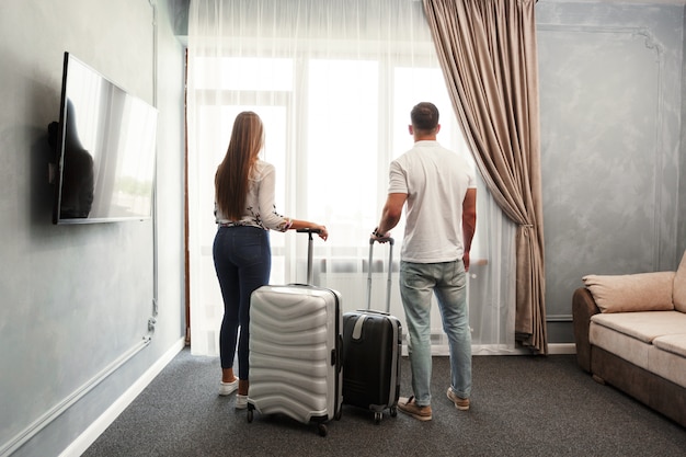 Young couple travel together hotel room leisure