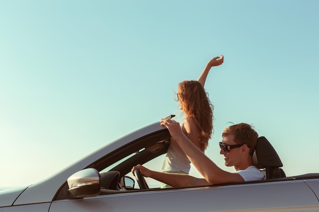 Young couple traveling by car