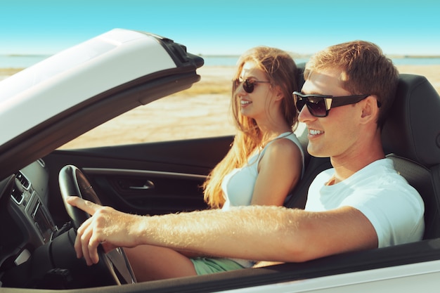 Young couple traveling by car