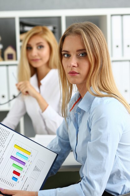 Young couple trying to get loan at bank clerk consultant