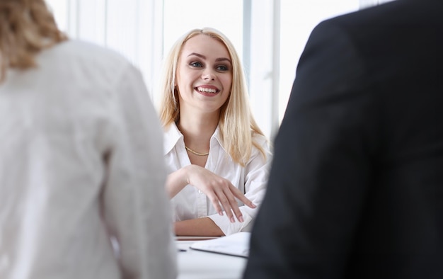 Young couple trying to get loan at bank clerk