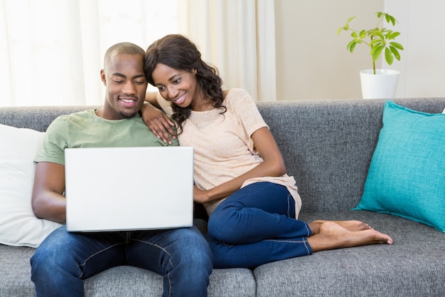 Young couple using a laptop