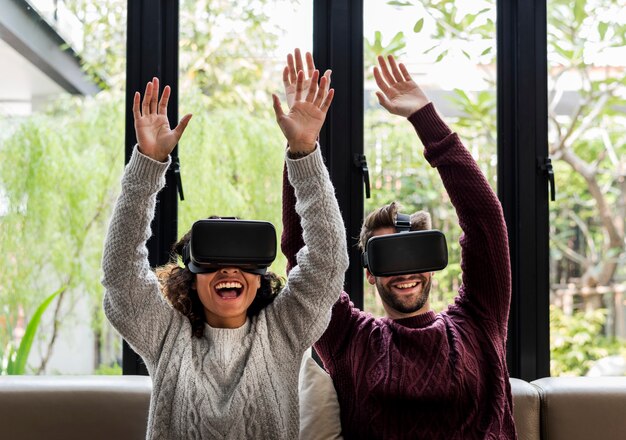 Young couple using VR together