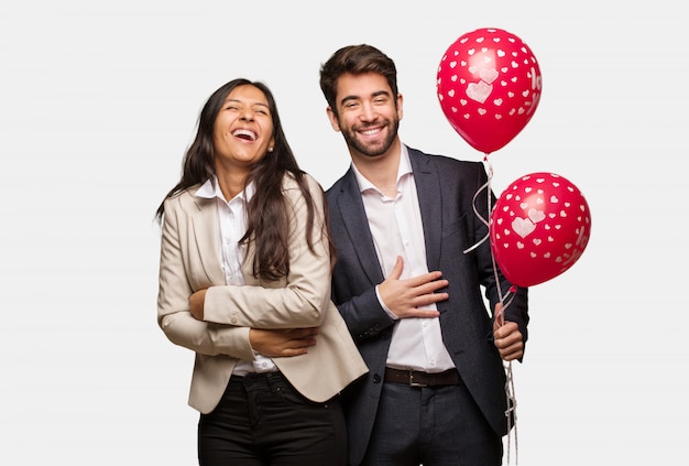 Young couple in valentines day laughing and having fun