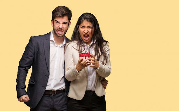 Photo young couple in valentines day screaming very angry and aggressive