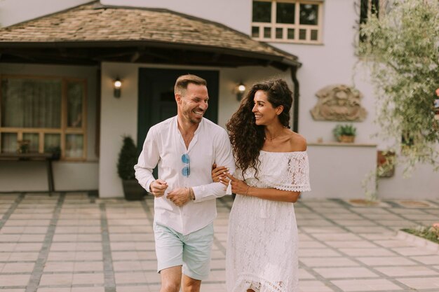 Young couple walking in the backyard