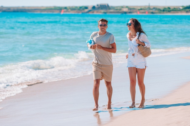 Young couple walking on the beach