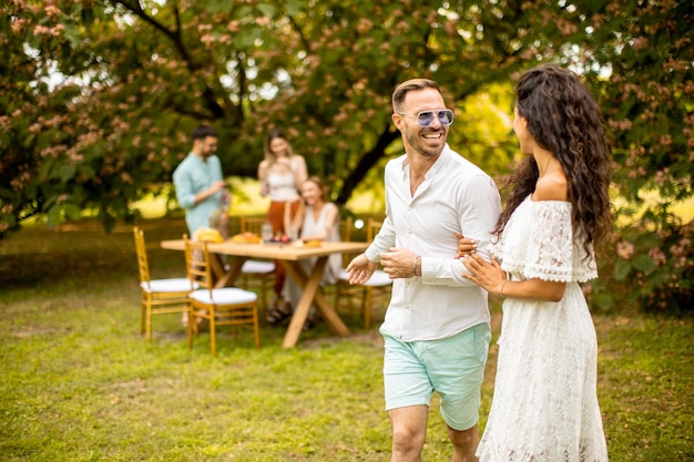 Young couple walking in the garden