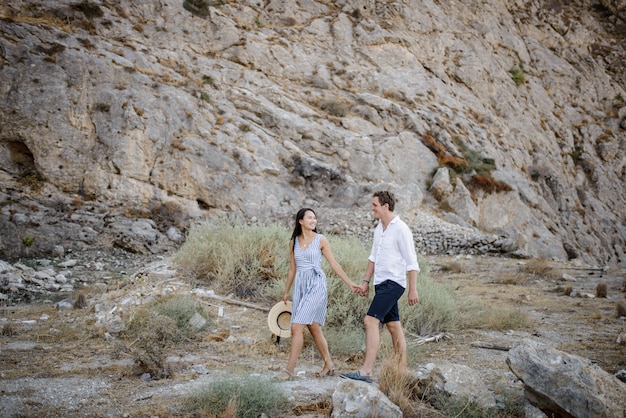 Young couple walking in the mountains