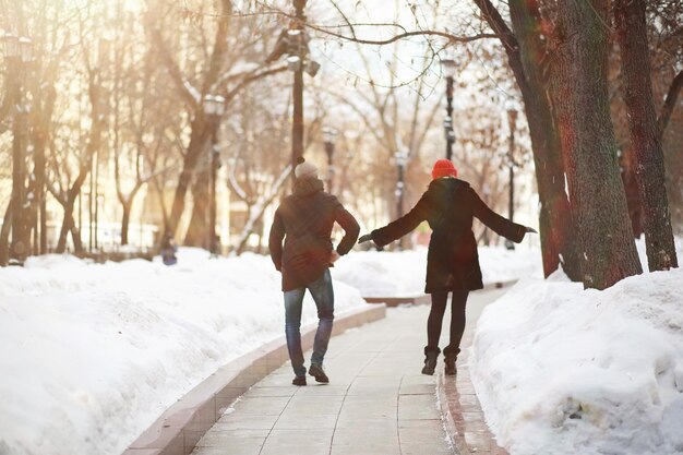 Young couple walking through the winter city