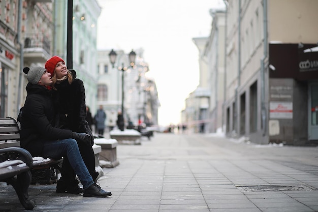 Young couple walking through the winter city