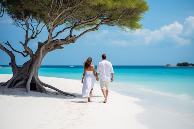 young couple walking on white sand beach on paradise island