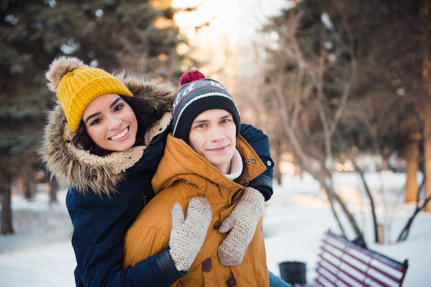 young couple walking winter park