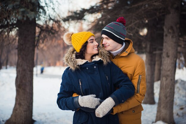 young couple walking winter park