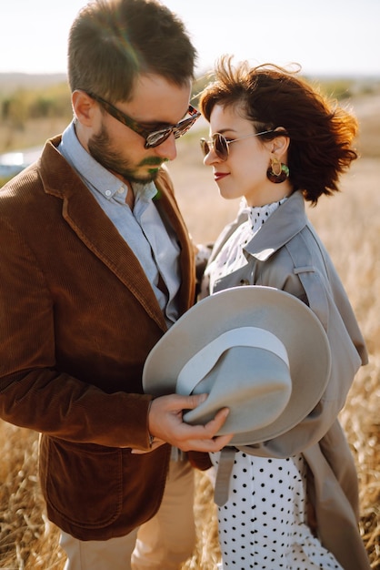 Young couple walks in the park during the spring and hugs Enjoying time together