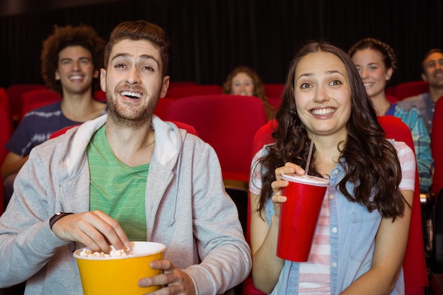 Young couple watching a film