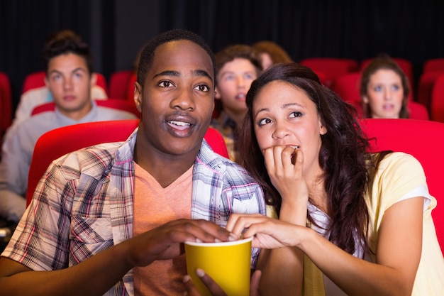 Young couple watching a film