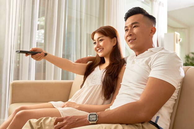 Young couple watching TV