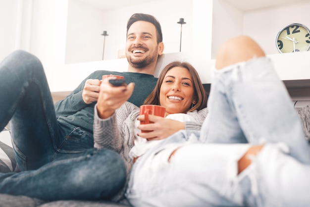 Young couple watching tv