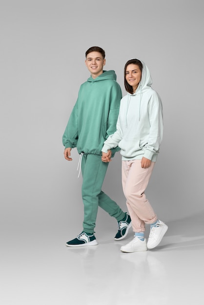 Young couple wearing mint green casual hoodie