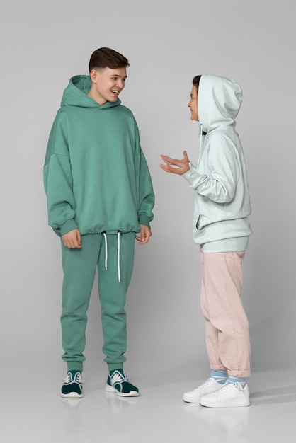 Young couple wearing mint green casual hoodie