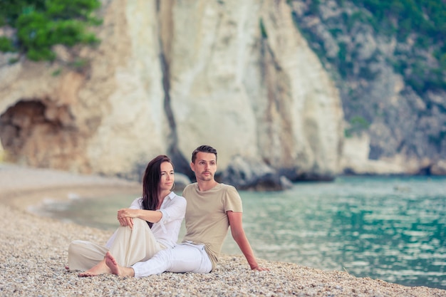 Young couple on white beach at summer vacation