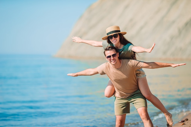 Young couple on white beach during summer vacation.