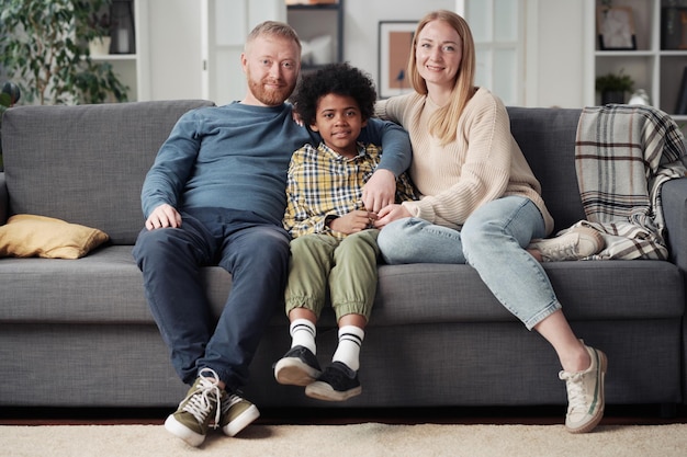 Young couple with adoptive child