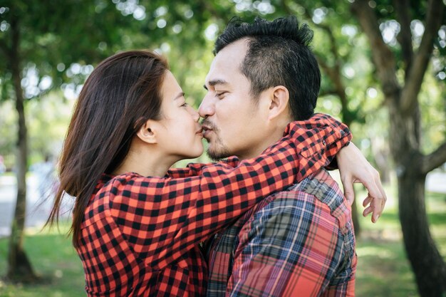 Young couple with arm around at park