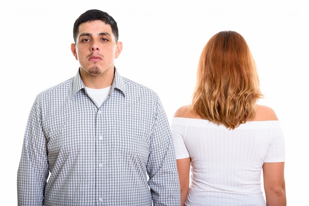 young couple with back view of woman isolated on white